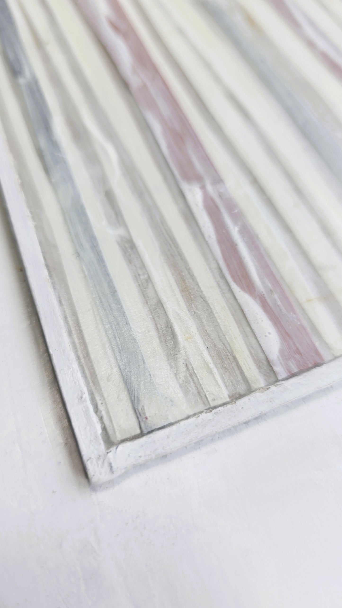 Angled close-up of In-Line Minimalist Mixed Media Art by Carrie Bergey showing raised acrylic textures and layered paper and wood elements.