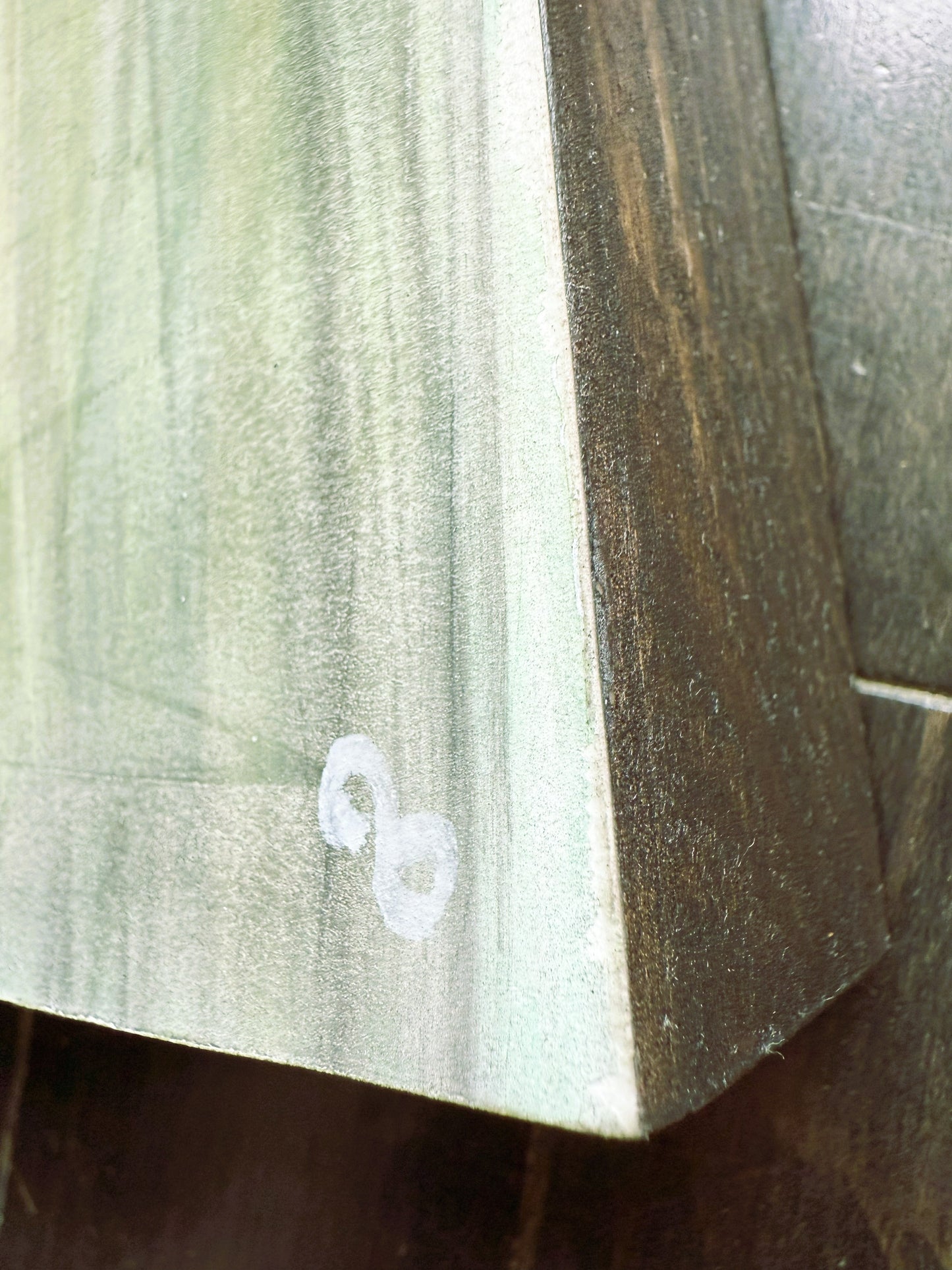 Corner detail of 'In the Haze' original pastel monoprint art by Carrie Bergey, highlighting the artist's signature and canvas texture.