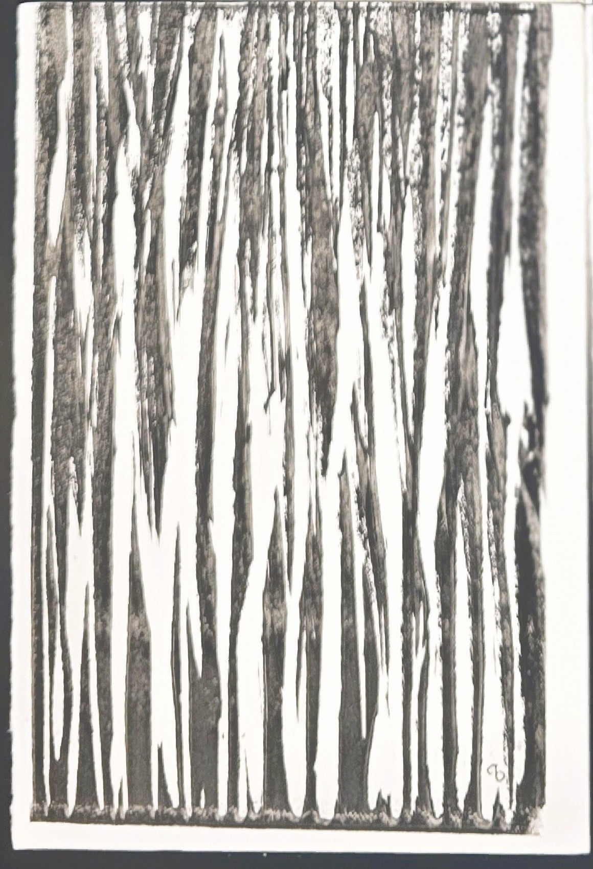 Close-up of bottom left panel from In the Weeds Monoprint Quadriptych by Carrie Bergey, with dense vertical black lines on white paper.
