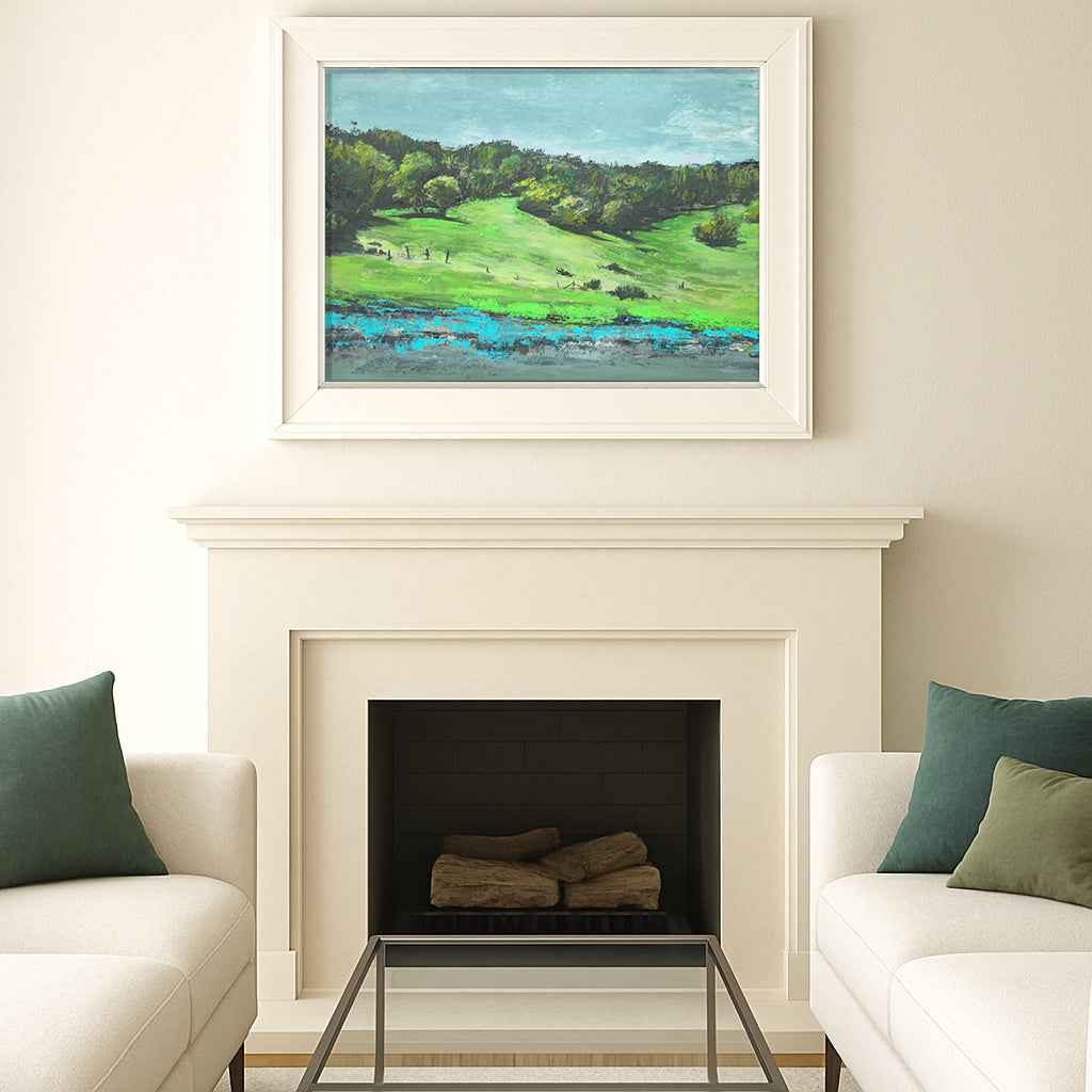 Framed Olompali State Historic Park US-101 painting by Carrie Bergey displayed above a fireplace in a modern living room, enhancing home decor with natural landscape art.