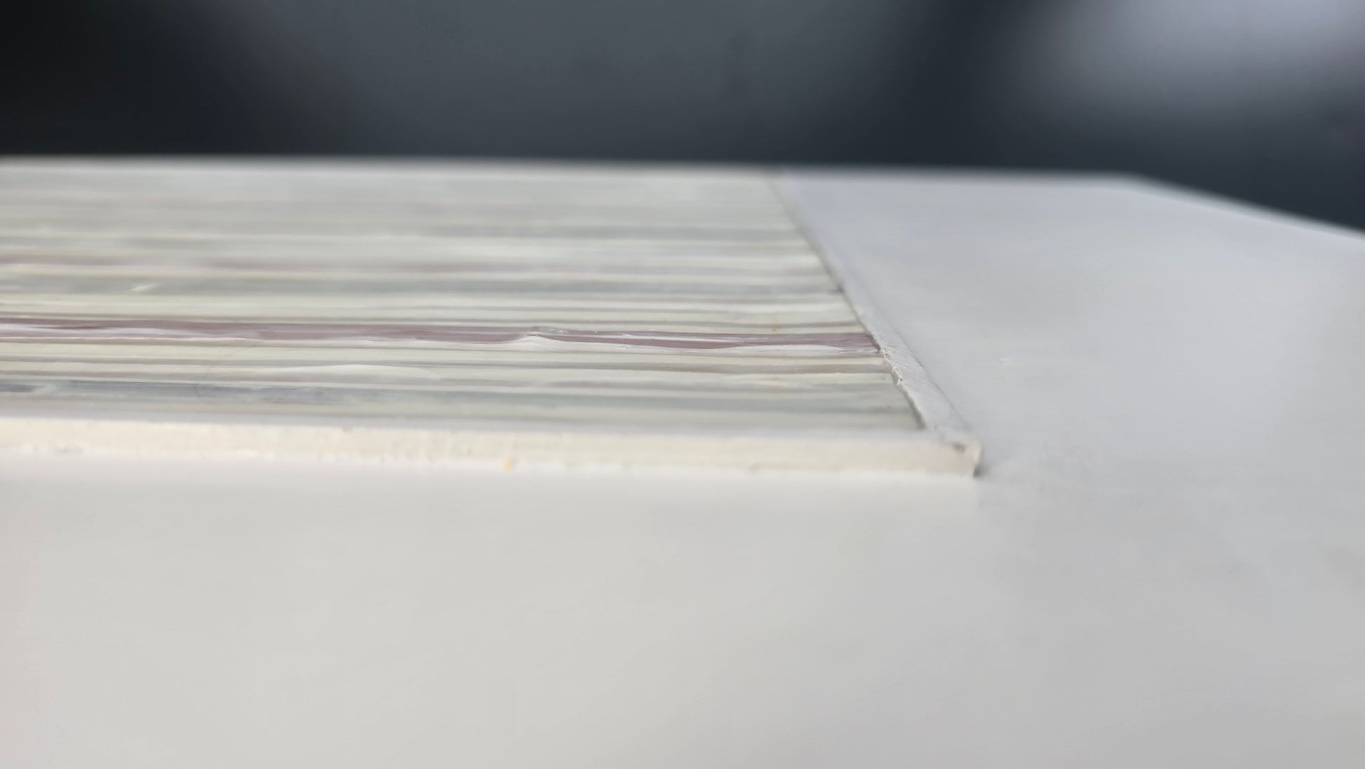 Side view of In-Line Minimalist Mixed Media Art by Carrie Bergey emphasizing the dimensional depth of the mixed media surface.