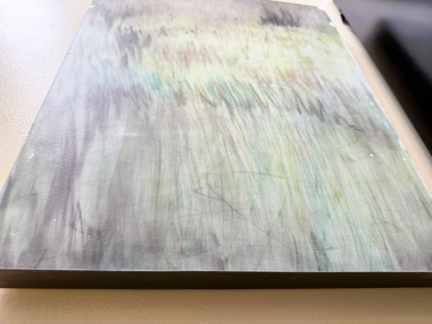 Angled view of 'In the Haze' pastel monoprint by Carrie Bergey, emphasizing the depth and movement in the abstract composition.