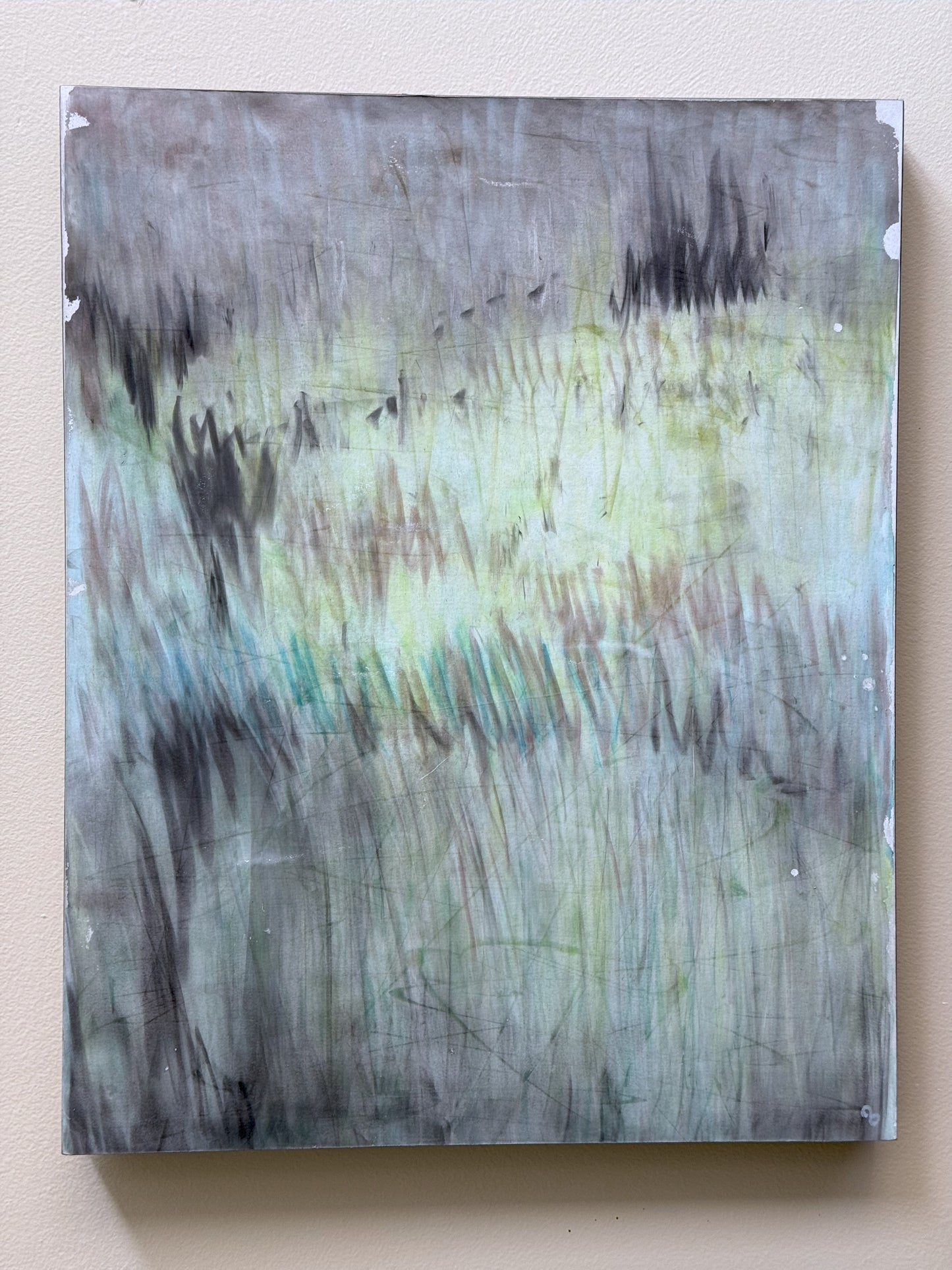 'In the Haze' original pastel monoprint by Carrie Bergey mounted on a wall, displaying its abstract, atmospheric design in soft tones.